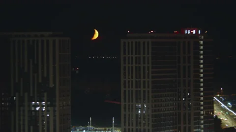 The beautiful moon motion on the cityscape background. time lapse Video stock 134359778