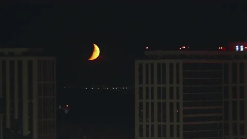 The beautiful moon motion on the cityscape background. time lapse Stock Footage 134359802