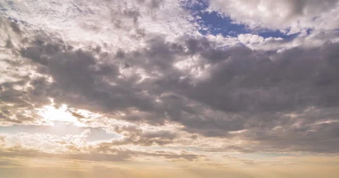 Beautiful morning cloudy sky. Dramatic sunrise. Natural colors. Sun rays emerge 스톡 동영상 264113384