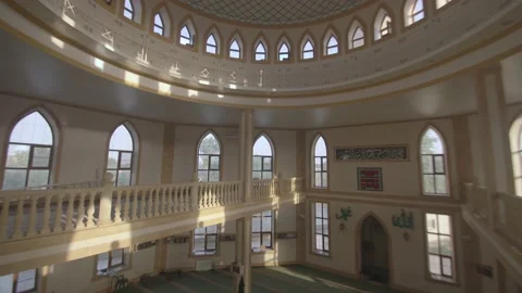 A beautiful mosque from the inside with a balcony and a large prayer hall for Vídeo Stock 233901985