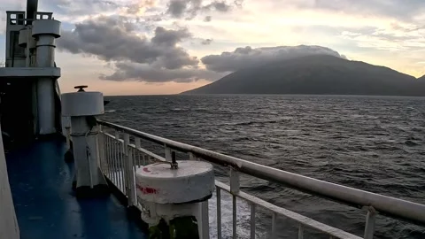 Beautiful Mountain and Ocean Waves During Sunrise Stock Footage 233648189