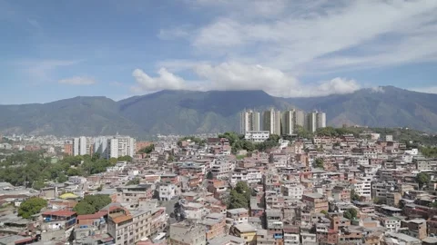 Beautiful mountain background with a great contrast of poor Latino neighborhood Stock Footage 304096806