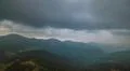The beautiful mountain on the background of rainy cloud. Wide angle Photo