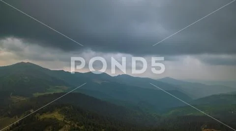 The beautiful mountain on the background of rainy cloud. Wide angle Stock Photos