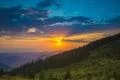 The beautiful mountain on the background of sunset. Wide angle Photo