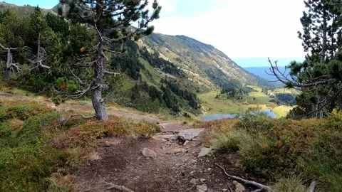 Beautiful mountain hike with view over the lake. Video stock 146041053