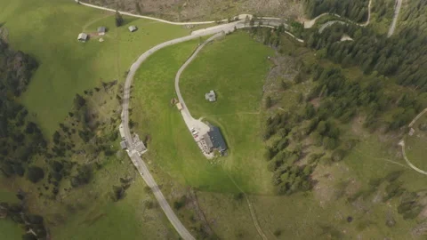 Beautiful mountain house surrounded by grass Stock Footage 143372391