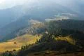The beautiful mountain landscape on the background of mist. Wide angle Photo