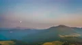 The beautiful mountain landscape on the background of the moon. Time lapse 4k or 4k+ Resolution