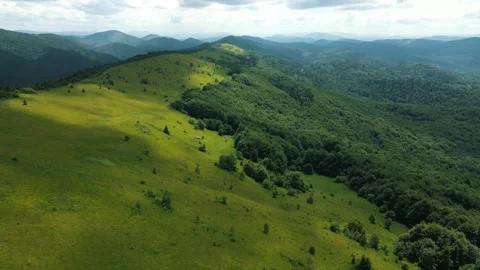 Beautiful mountain landscape, copter flight over forested mountain area Stock Footage 283584053