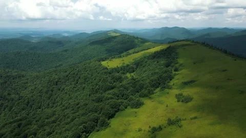Beautiful mountain landscape, copter flight over forested mountain area Stock Footage 283585254