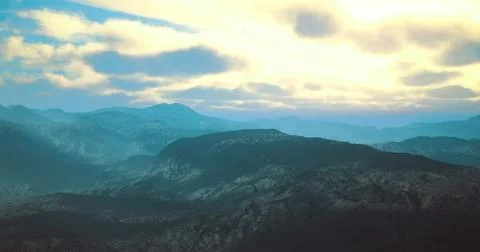 Beautiful mountain landscape with dramatic clouds and soft light at dusk Stock Illustration