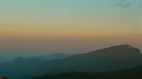 Beautiful mountain landscape during sunset with vibrant sky colors, Stock Footage 280176923