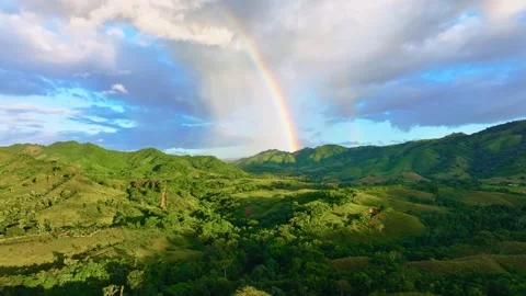 Beautiful mountain landscape with rainbow. Drone flights during rain. Stock Footage 320493607