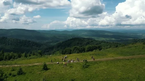 Beautiful mountain landscape, tourists stopped to rest on the mountain path Stock Footage 282914357