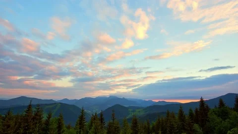 Beautiful mountain nature in spring. Clouds and landscape are colored in rich Stock-Footage 196984101