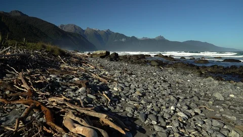 Beautiful mountain range and ocean waves on a sunny day Stock Footage 91159182