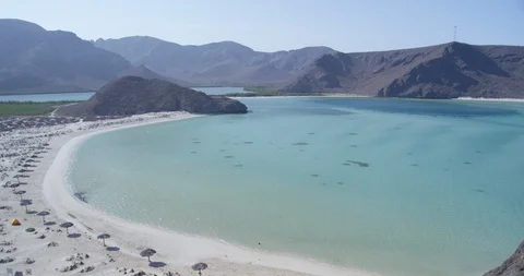 Beautiful mountain range and turquoise sea on a sunny day Stock Footage 85805299