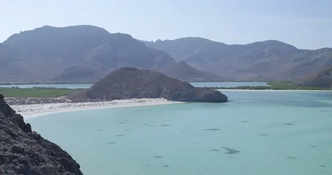 Beautiful mountain range and turquoise sea on a sunny day Stock Footage 85805976