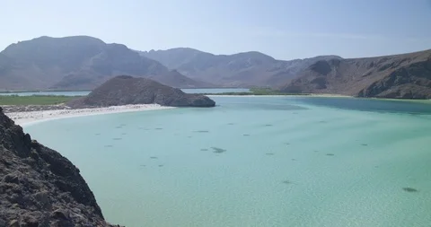 Beautiful mountain range and turquoise sea on a sunny day Stock Footage 85806126