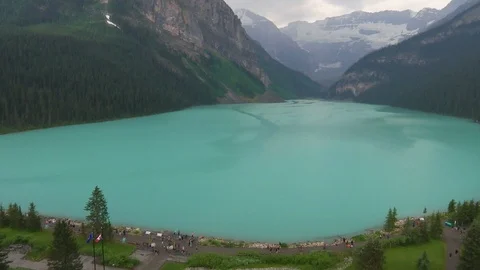 Beautiful mountain range and turquoise lake at dusk Stock Footage 99080612