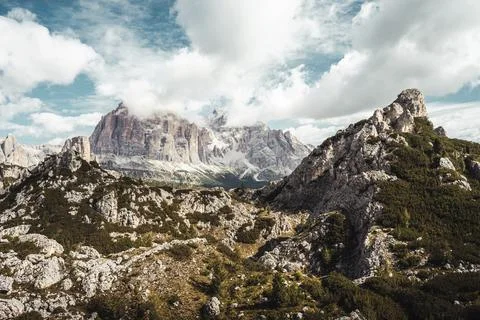 A beautiful mountain range with a cloudy sky in the background Stock Photos