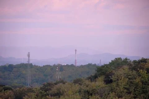 A beautiful mountain range with a few trees in the foreground Stock Photos
