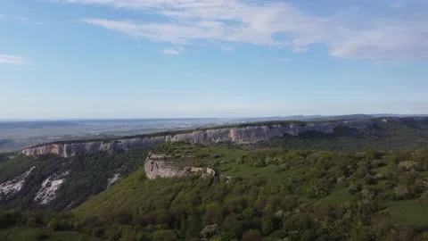 A beautiful mountain range from the height of the drone in clear sunny weather Stock Footage 154559580