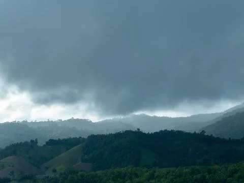 Beautiful mountain range landscape timelapse with low clouds moving in twilight. 스톡 사진