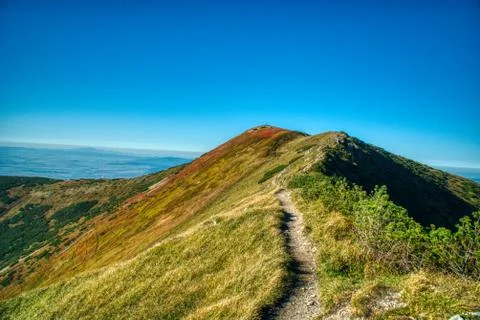 Beautiful mountain range in the mountains summer on a small road between Zili Stock Photos