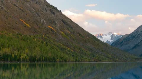 Beautiful mountain range with snow on the peak are reflected in the lake. Stock Footage 21266752