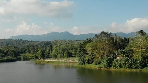 A beautiful mountain range is visible in the background of a river Video stock 278580114