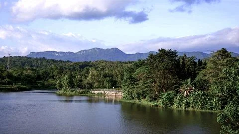 A beautiful mountain range is visible in the background of a lake Stock Photos