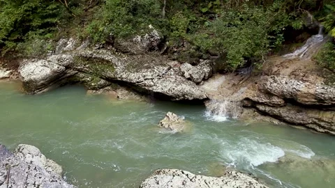 Beautiful mountain river in the autumn forest on a sunny day. Stock Footage 163529316