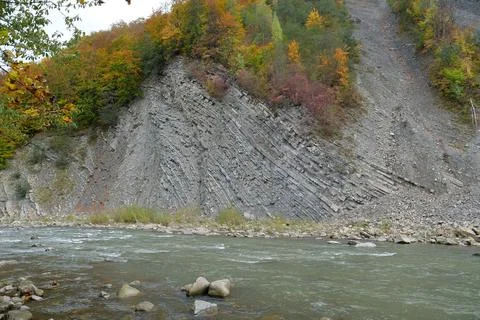 Beautiful mountain river with rapid current. Prut river and mountain folds Photos