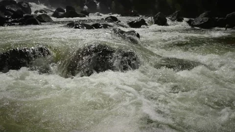 Beautiful mountain river, stream, flowing through the stones Video stock 129707630