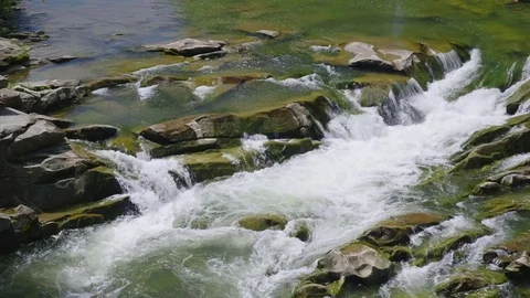A beautiful mountain river. The water is boiling on the rocks, the top view Stock Footage 80090267