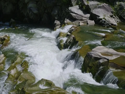 A beautiful mountain river. The water is boiling on the rocks Stock Footage 80119517