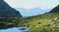 Beautiful mountain scenery, green rocky valley with clear lake HD Footage