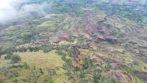 Beautiful Mountain Side Shrouded in Clouds Aerial Drone Shot Bali Stock Footage 144047768