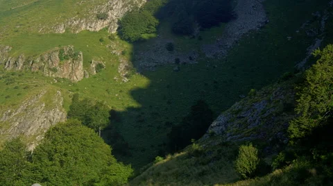 Beautiful mountain time lapse with moving shadows and clouds in blue sky Stock Footage 61112236