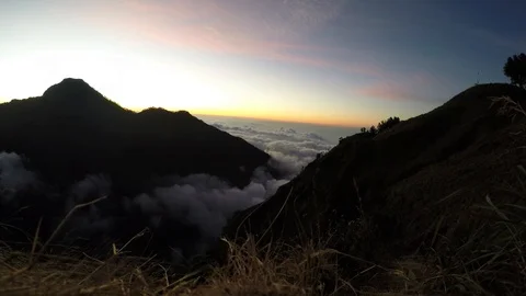 Beautiful Mountain Timelapse Above the Clouds on Mt Rinjani at Sunset in Stock Footage 94537151