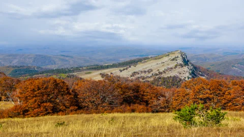 Beautiful mountain valley under a cloudy sky Stock Footage 150680994