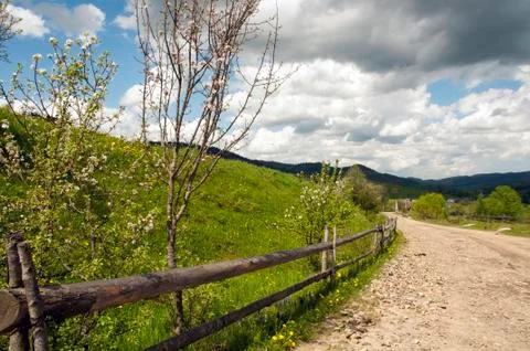 Beautiful mountain valleys and mountains on a bright sunny day on the backgro Stock Photos