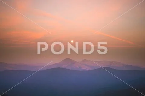 The beautiful mountain view on the background of sunrise. Wide angle Stock Photos