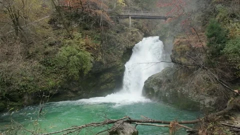 Beautiful mountain waterfall cascading into crystal clear turquoise pool in.. Stock Footage 337802952