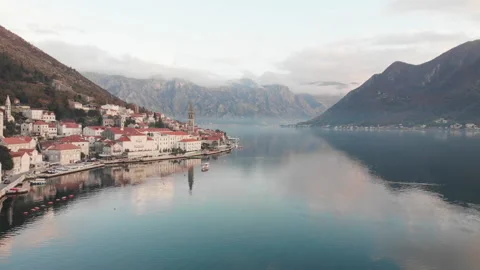 Beautiful mountains and clouds on the background of the city of Perast Video stock 166496849