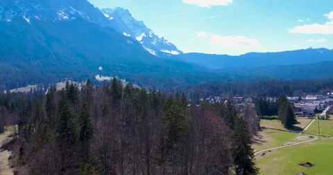 Beautiful Mountains and Green Fields in Bavaria With Trees and a Small Town Stock Footage 334857099