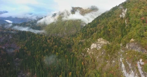 Beautiful mountains and road in the clouds. Aerial Stock Footage 117768380