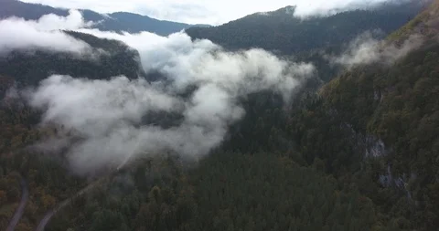Beautiful mountains in the clouds. Aerial Stock Footage 117768188